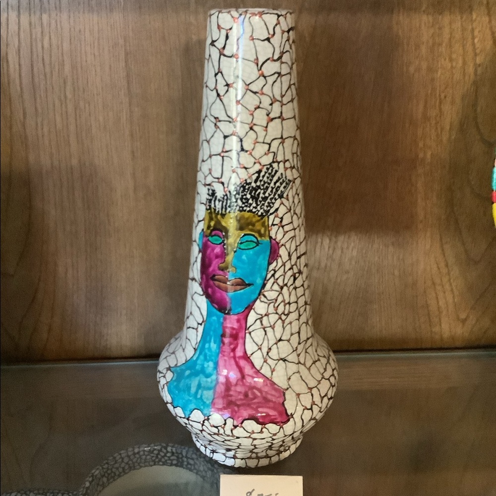 Decorative hand painted and artist signed vase.